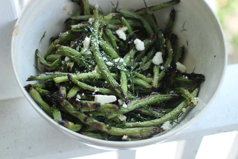 This May 18, 2015 photo shows grilled green beans with honey, feta and dill in Concord, N.H. (AP Photo/Matthew Mead)