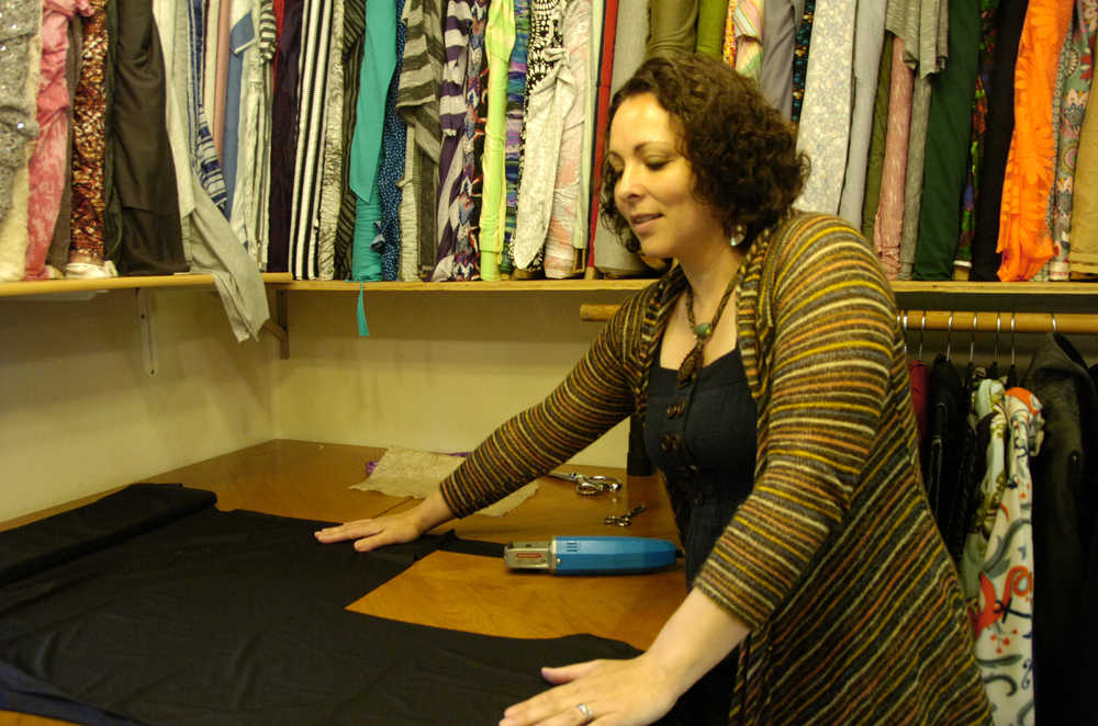 Photo by Megan Pacer/Peninsula Clarion Clothing designer Susanna Evins, of Soldotna, prepares her next garment Wednesday in her new location for Mountain Mama Originals in Soldotna.