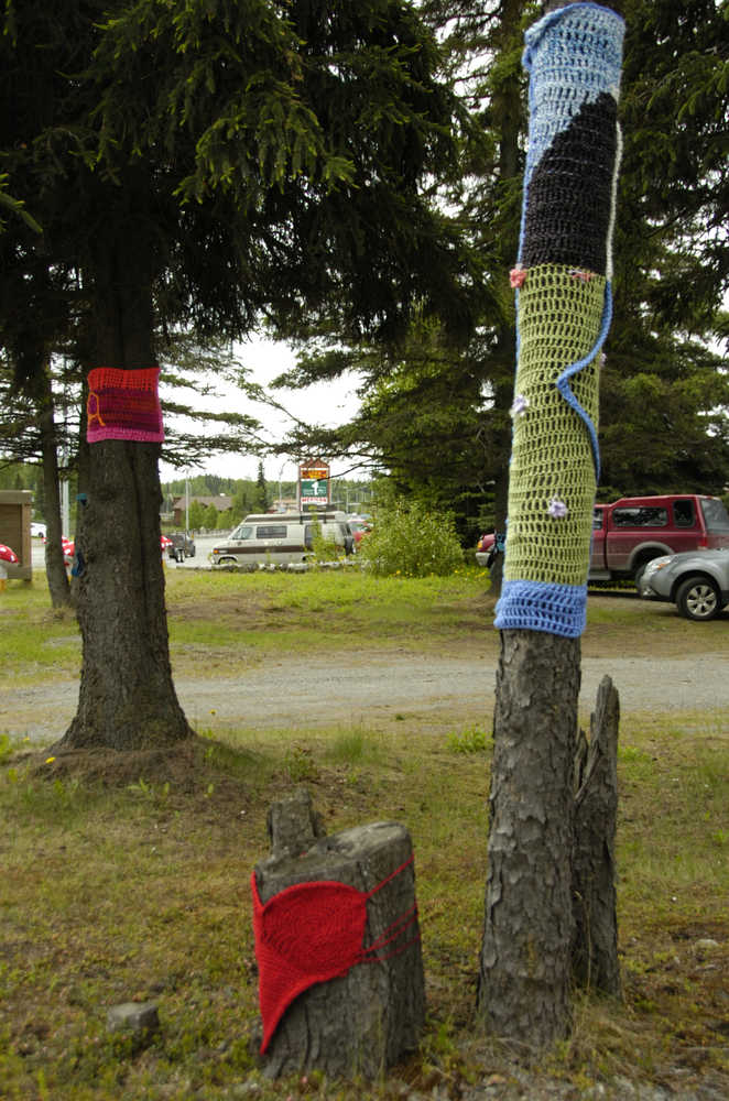 Photo by Megan Pacer/Peninsula Clarion Handcrafted decorations clothe the trees and attract passersby to three newly opened shops on Wednesday in Soldotna.