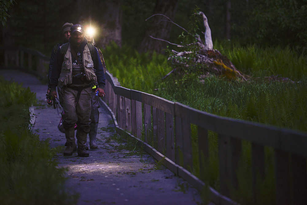 Photo by Rashah McChesney/Peninsula Clarion Anglers descended on the Russian River Thursday June 11, 2015 for the season's sockeye salmon opener near Cooper Landing, Alaska. The period, which opens at midnight, drew enough anglers that many waited for more than an hour to gain access to the campground which was filled to capacity.