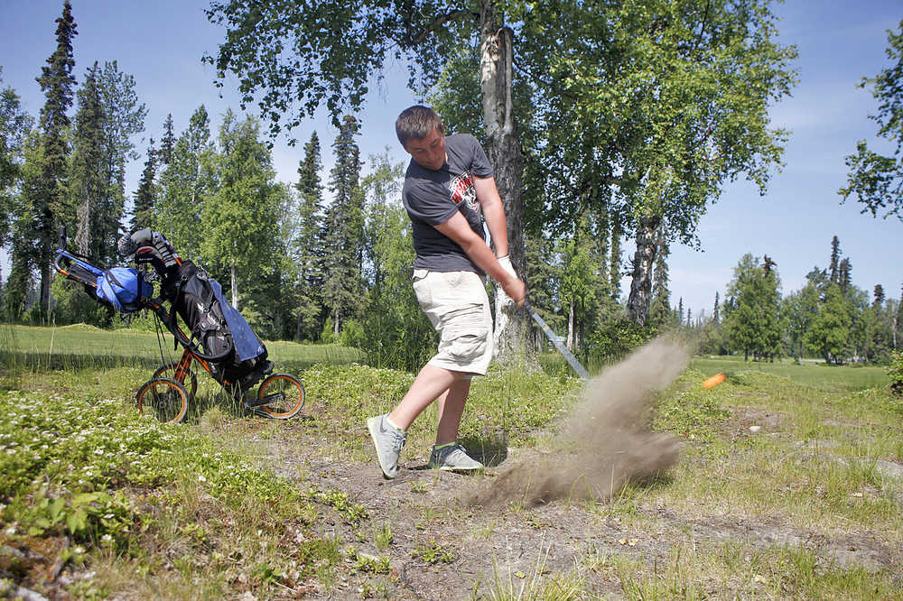 Photo by Rashah McChesney/Peninsula Clarion Brock Cant hits away from a group of trees during the Junior's Golf Tournament on June 18, 2015 at the Birch Ridge Golf Course in Soldotna, Alaska.