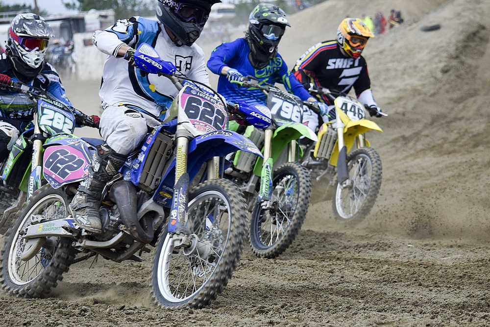 Photo by Rashah McChesney/Peninsula Clarion  Racers take off during a state motocross meet on Saturday June 20, 2015 at the Twin City Raceway in Kenai, Alaska.