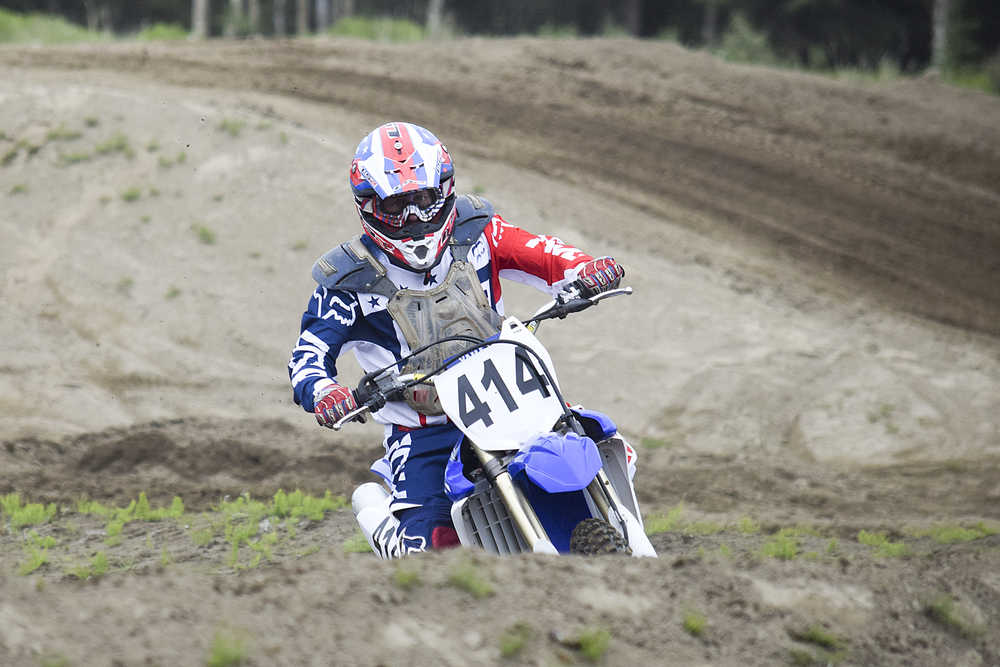 Photo by Rashah McChesney/Peninsula Clarion  Mike Kelly competes in a state motocross meet on Saturday June 20, 2015 at the Twin City Raceway in Kenai, Alaska.