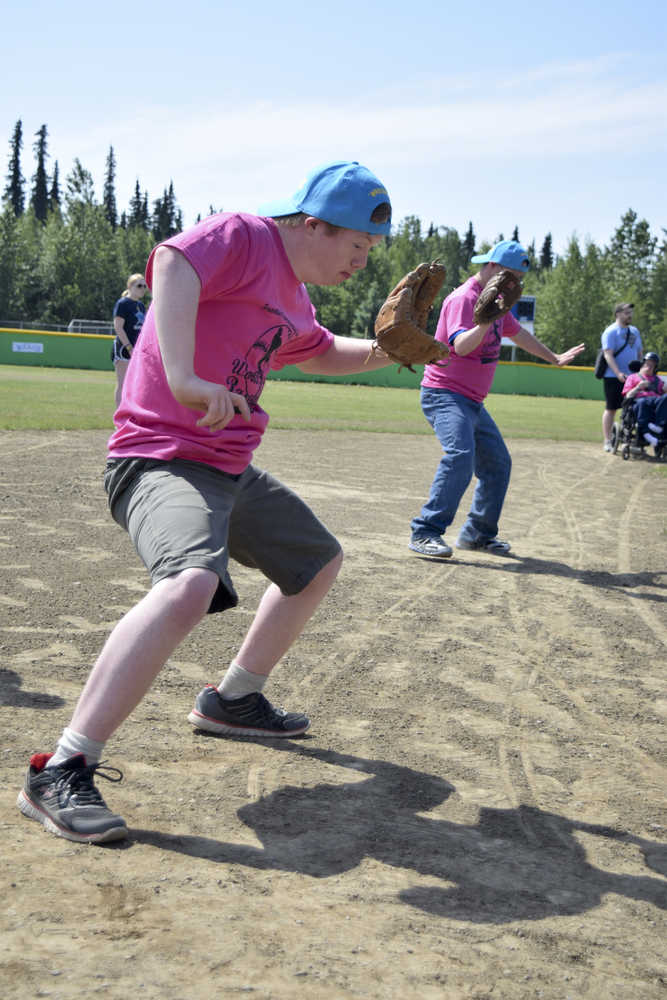 Photo by Rashah McChesney/Peninsula Clarion Infielders dance while waiting for a player to bat during the annual World Series of Baseball event put on for community members with special needs on Friday June 19, 2015 in Soldotna, Alaska.