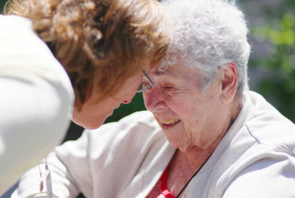 Photo by Kelly Sullivan/ Peninsula Clarion Gwen Johnson talks to Louise Harbison at Heritage Place Monday, June 22, 2015, in Soldotna, Alaska.