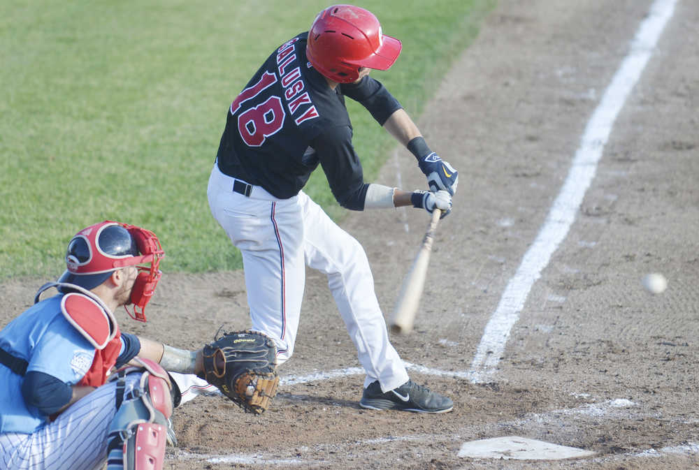 Photo by Kelly Sullivan/ Peninsula Clarion Jimmy Galusky makes contact with th ball in the game against the Seattle Studs, Thursday, June 25, 2015, at Coral Seymour Park in Kenai, Alaska.