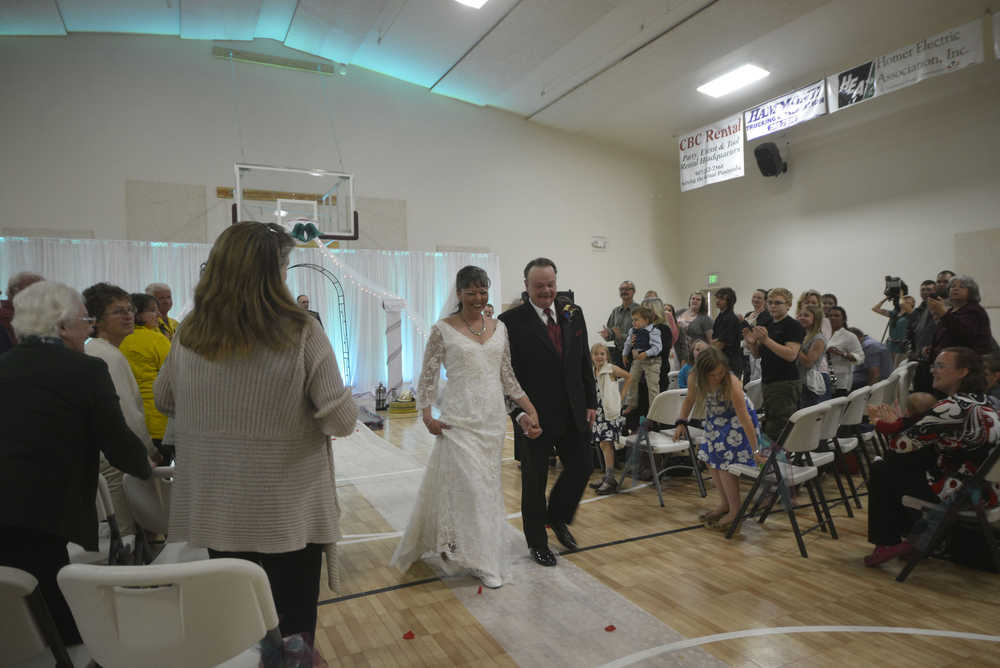 Photo by Megan Pacer/Peninsula Clarion Firefighting-themed cupcakes and tools decorate a wedding held on Sunday afternoon at the Sterling Community Center.