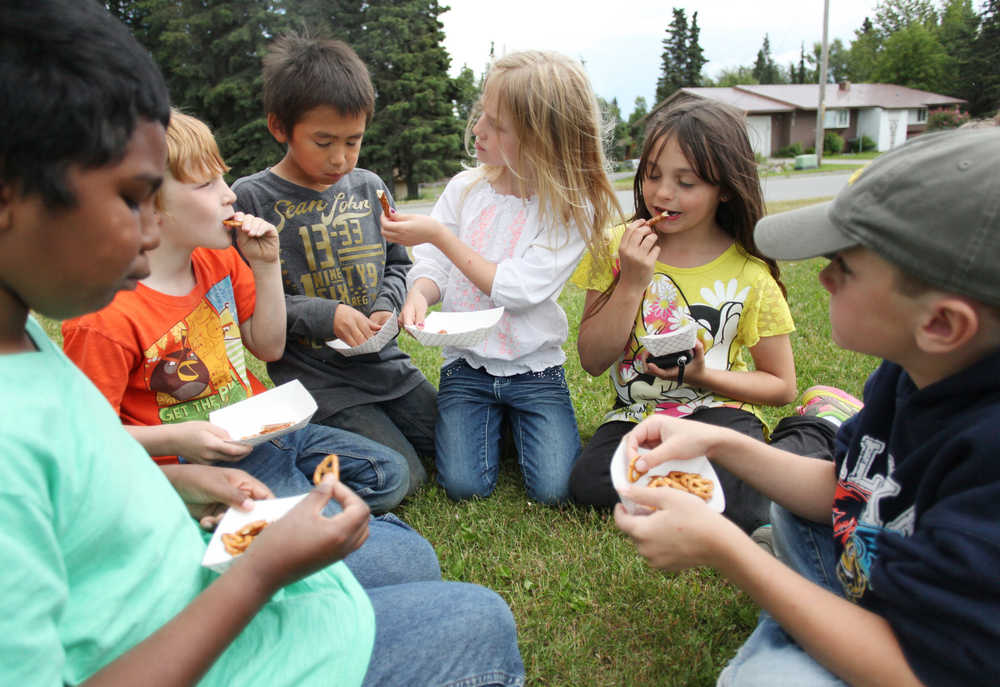 Photo by Kelly Sullivan/ Peninsula Clarion The Kenai Boys and Girls Club clubhouse serves breakfast, lunch and a snack Monday through Friday during the week to all children in the community 18 years or under through the Summer Food Service Program for Children, Tuesday, June 30, 2015, in Kenai, Alaska.