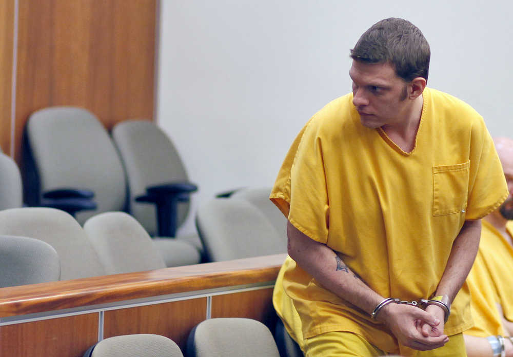 Photo by Rashah McChesney/Peninsula Clarion Jeremy Anderson, former Nikiski Middle-High School student music teacher accused of raping one of his students, walks out of a Kenai courtroom Tuesday Nov. 25, 2014 in Kenai, Alaska.