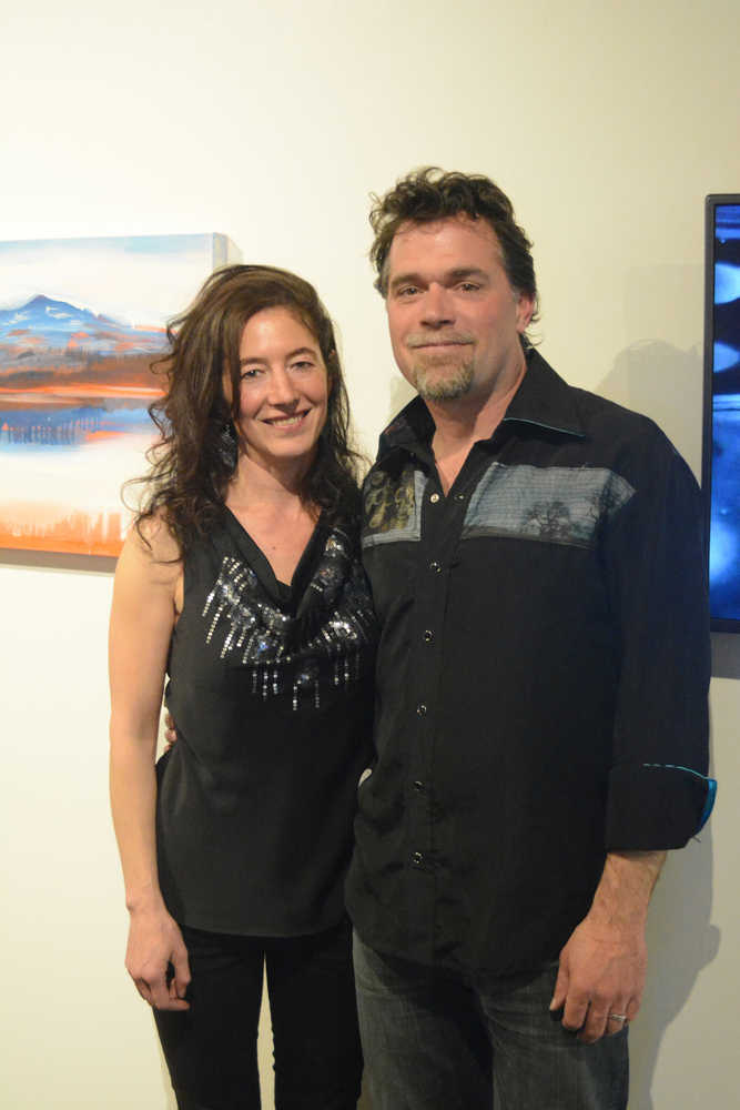 Asia Freeman, left, and Michael Walsh, right, pose at the June 4 opening of their show, "Watermark," at the Pratt Museum.