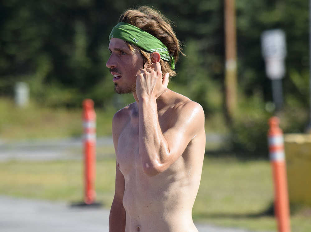 Photo by Rashah McChesney/Peninsula Clarion Sam Tilly chats with a reporter after winning the 10-mile Rotary Unity Run on Saturday July 11, 2015 in Soldotna, Alaska.