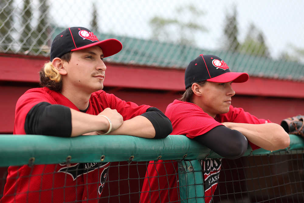 Photo by Kelly Sullivan/Peninsula Clarion Paul Lujan and Sean Michael watch an Oilers game on June 25, 2015 in Kenai, Alaska. Lujan and Michael, both attended West Texas A&M University, are relief pitchers for the Peninsula Oilers looking for a pro opportunity.