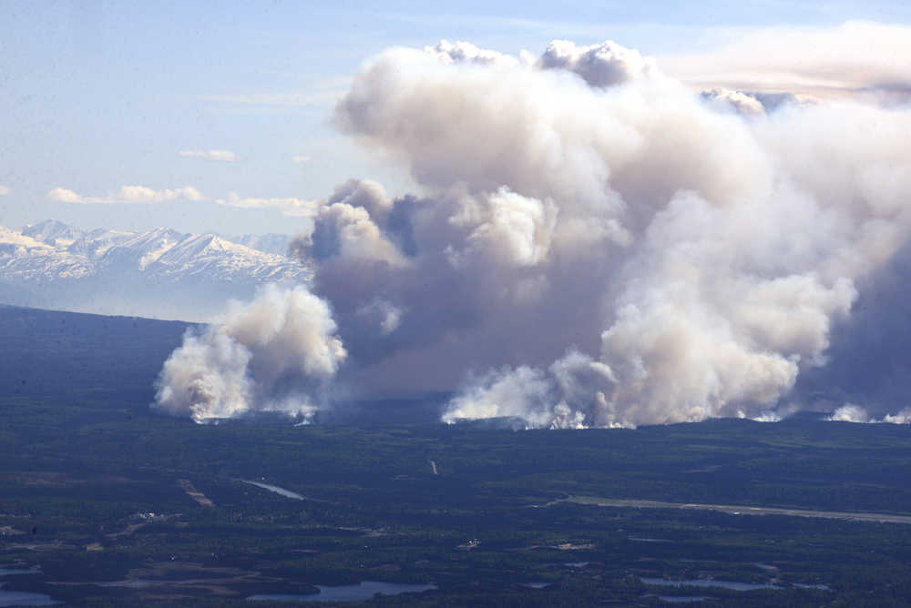 Photo by Rashah McChesney/Peninsula Clarion In this May 20, 2014 file photo the Funny River wildfire spreads more than 10 miles long and one mile wide on the Kenai Peninsula. The wildfire cost several million dollars to combat, however the Kenai Peninsula Borough recouped much of its costs. It expects to do the same for the Card Street wildfire.