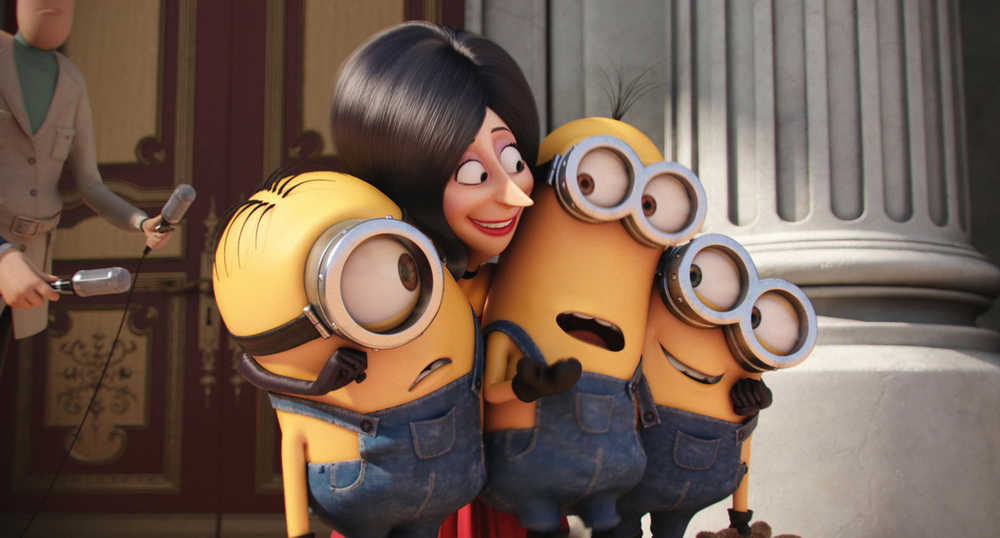 In this image released by Universal Pictures, Scarlet Overkill, voiced by Sandra Bullock, second left, appears with minions Stuart, left, Kevin and Bob, right, in a scene from the animated feature, "Minions." (Illumination Entertainment/Universal Pictures via AP)