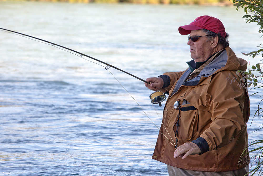 Photo by Rashah McChesney/Peninsula Clarion  Paul Pichette fishes at the confluence of the Kenai and Funny Rivers on Wednesday July 14, 2015 in Funny River, Alaska. Anglers reported slow, small catches of sockeye that have been picking up over the last few days.