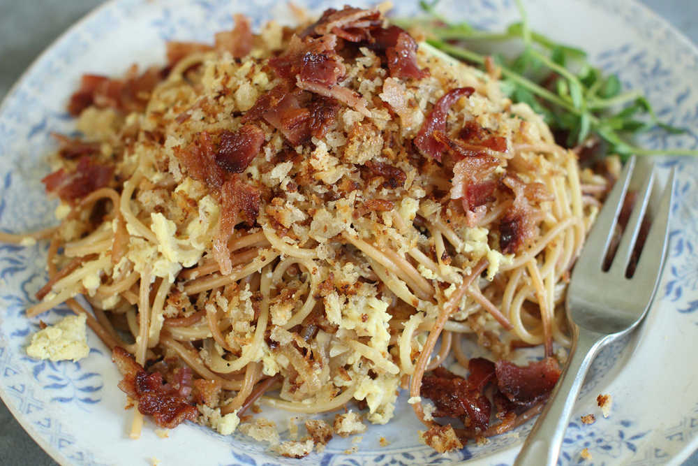 This June 22, 2015 photo shows breakfast for dinner spaghetti in Concord, N.H. This dish is from a recipe by Sara Moulton. (AP Photo/Matthew Mead)