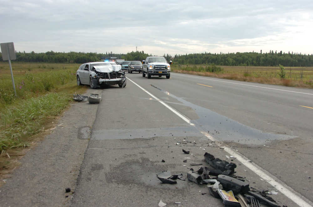 Photo by Megan Pacer/Peninsula Clarion Traffic slows as it approaches the scene of a two-vehcile collision on Bridge Access Road on Tuesday afternoon in Kenai, Alaska.