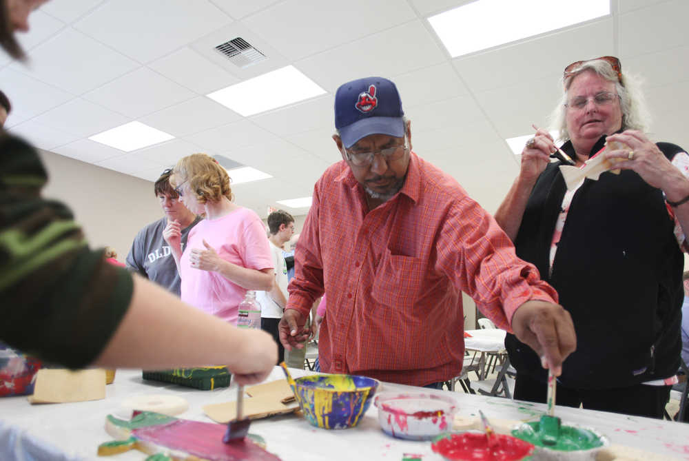 Photo by Kelly Sullivan/ Peninsula Clarion Eddie Escalera, Hope Community Resources' only Homer client, and Peggy Brown drove up from the South Kenai Peninsula to attend the opening of the new Kenai Community Center Thursday, July 30, 2015, in Soldotna, Alaska.