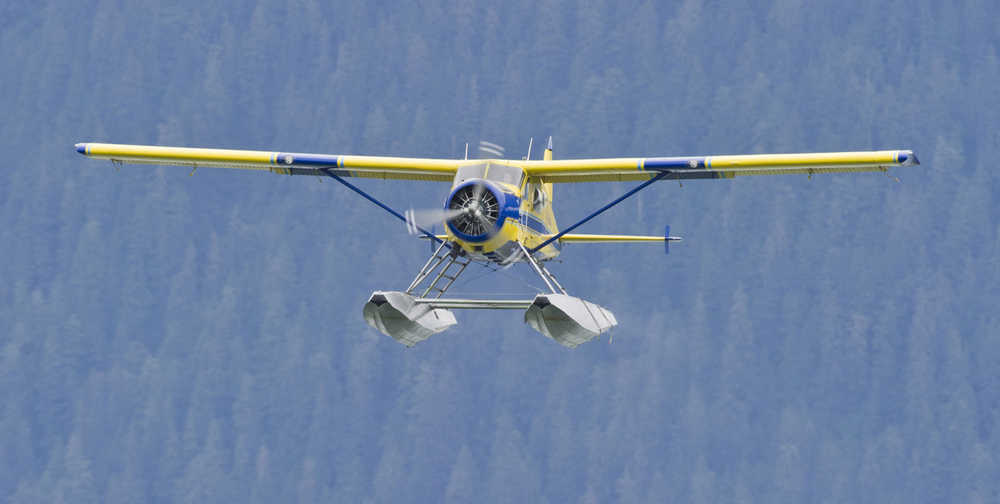 ADVANCE FOR SUNDAY, AUG. 2, 2015. In this Saturday, July 18, photo, an Alaska Seaplanes floatplane takes off at the Juneau International Airport in Juneau, Alaska. Life at a higher altitude with a spectacular view is the only kind of life Sean Kveum has known since his days growing up in Hoonah. " (Michael Penn/Juneau Empire via AP)