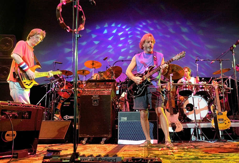 FILE - In this Aug. 3, 2002 file photo, The Grateful Dead, from left, Phil Lesh, Bill Kreutzmann, Bob Weir and Mickey Hart perform during a reunion concert in East Troy, Wis. Mickey Hart, Bill Kreutzmann and Bob Weir have joined forces with John Mayer to form the band, Dead & Company. They will perform a show on Oct. 31 at Madison Square Garden in New York. (AP Photo/Morry Gash, File)