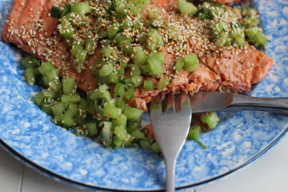This March 16, 2015  photo shows grilled coho salmon with sesame celery relish  in Concord, NH. (AP Photo/Matthew Mead)