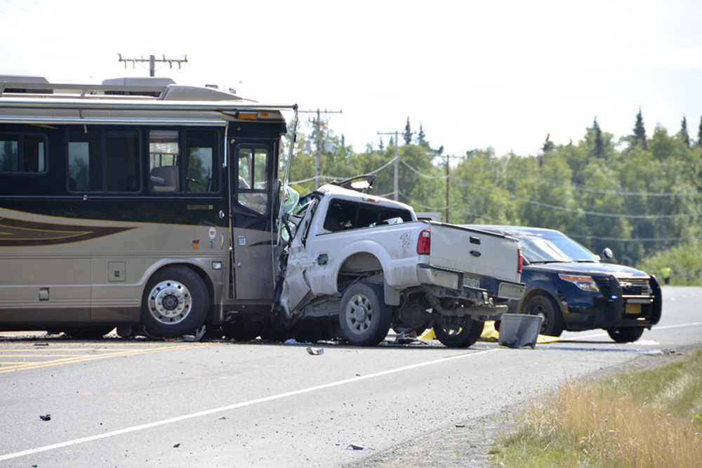 Photo by Megan Pacer/Peninsula Clarion  Two people are dead and the Kenai Spur Highway is closed after a wreck between an RV and a truck on Wednesday August 5, 2015 in Kenai, Alaska. Authorities are asking that people who need to travel between Kenai and Soldotna take Kalifornsky Beach Road.