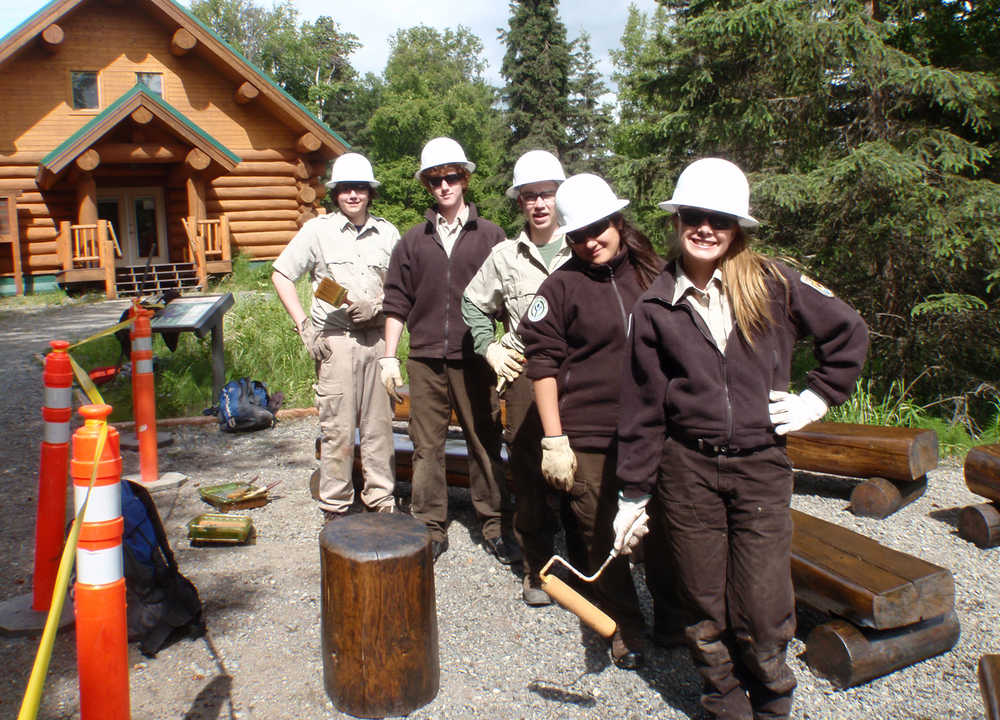 Back to front, Nathan Lervold, Talon Musgrave, Atom Skeeba, Elizabeth Keys and Amber Hamar repair benches used for outdoor educational programs at the Kenai National Wildlife Refuge Headquarters. (Photo courtesy Kenai National Wildlife Refuge)