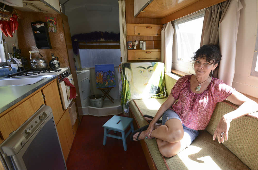 Deanna Wohlgemuth inside her 17-foot 1965 Airstream on Friday July 17, 2015 in Vancouver, Wash. Now dubbed the Tin Cantina, Wohlgemuth uses the Airstream as a traveling vintage bar.  (Natalie Behring/The Columbian via AP) MANDATORY CREDIT