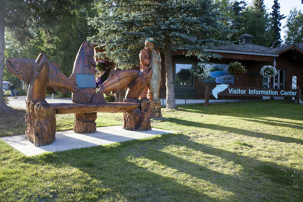 Photo by Rashah McChesney/Peninsula Clarion A series of wood carvings face the highway at Soldotna's Chamber of Commerce and Visitor Center at the junction of the Sterling Highway and Kalifornsky Beach Road on Tuesday August 11, 2015 in Soldotna Alaska. The chamber and the city's council will consider an agreement that would allow the chamber to plan and build a new center over the next five years on a city owned piece of property. The city would agree not to sell or develop the parcel in the interim.