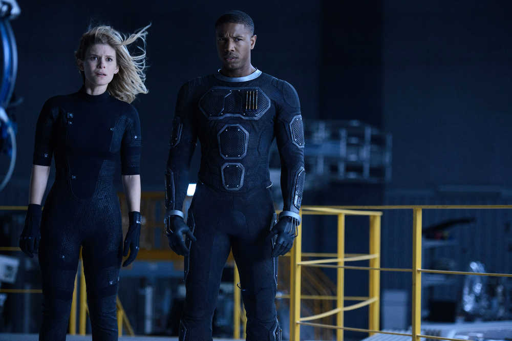 This photo provided by Twentieth Century Fox shows, Kate Mara, left, as Sue Storm, and Michael B. Jordan as Johnny Storm, in a scene from the film, "Fantastic Four." The movie releases in U.S. theaters on Friday, Aug. 7, 2015.  (Ben Rothstein/Twentieth Century Fox via AP)