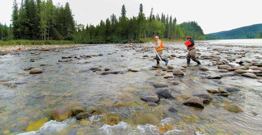 AP Photo/Frank Flavin/Alaska Energy Authority In this 2012 file photo, researchers walk along the Susitna River. With a spending freeze lifted by Gov. Bill Walker, work is resuming on the Susitna-Watana hydroelectric project. However, the authority will need about $100 million in new funding to get through the Federal Energy Regulatory Commission licensing process and to construction.