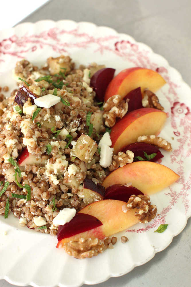 This July 13, 2015 photo shows kasha salad with beets, stone fruit, walnuts and mint in Concord, N.H. Kasha, the toasted form of buckwheat, cooks up in about 10 minutes. (AP Photo/Matthew Mead)