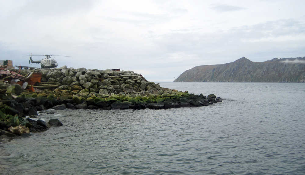 FILE - This Aug. 30, 2011, file photo provided by the U.S. Army Corps of Engineers shows Big Diomede Island in Russia, right background, as seen from Little Diomede Island in the U.S. state of Alaska, left foreground. Residents from the tiny Alaska Native village on Little Diomede are trying to reconnect with their long-lost relatives from Big Diomede, who were moved to Russia's Chukotka Peninsula after the island became a Russian military base during World War II. Three miles separates the islands, but it might as well be thousands of miles because Big Diomede is strictly off-limits. (George A. Kalli/U.S. Army Corps of Engineers via AP, File)