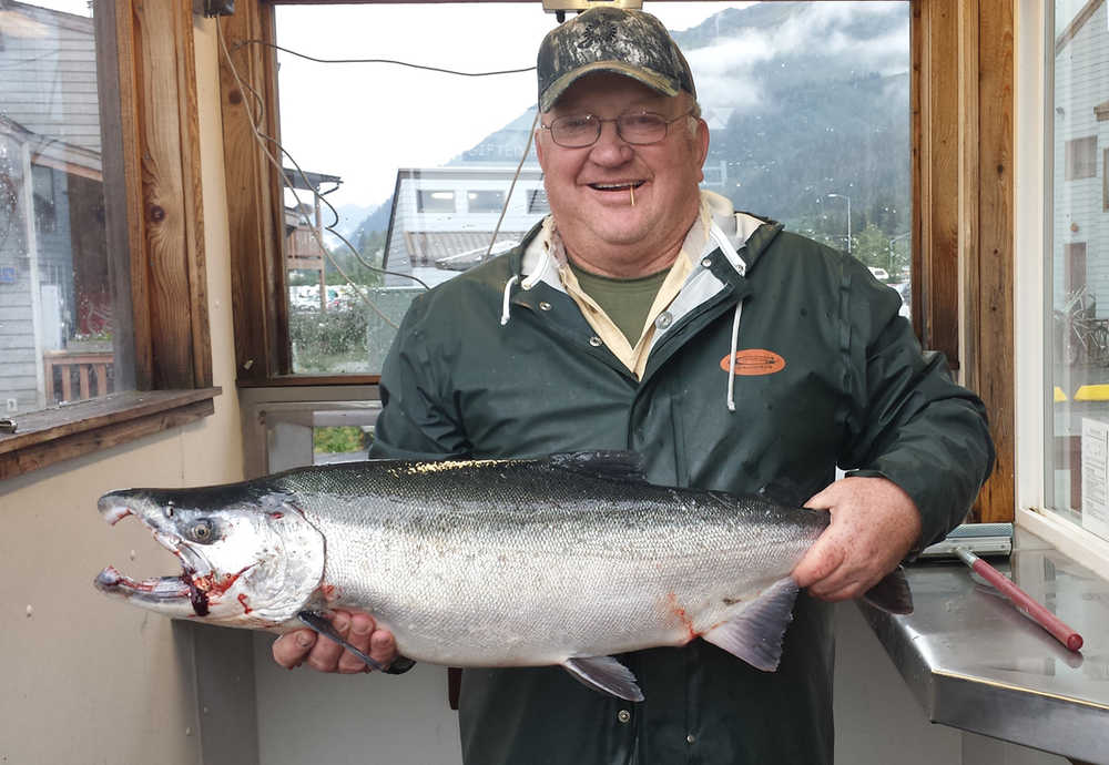 Jerry Bixby of Soldotna holds up a 16.19-pound silver salmon caught just before the close of the Seward Silver Salmon Derby Sunday. The fish was good for first place in the derby standings, making Bixby a two-time winner. (Photo courtesy Seward Chamber of Commerce)
