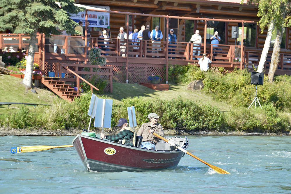 Protestors critical of the Kenai River Sportfishing Association prepare to launch onto the Kenai River from Swiftwater Park in Soldotna Wednesday. (Photo by Rashah McChesney/Peninsula Clarion)