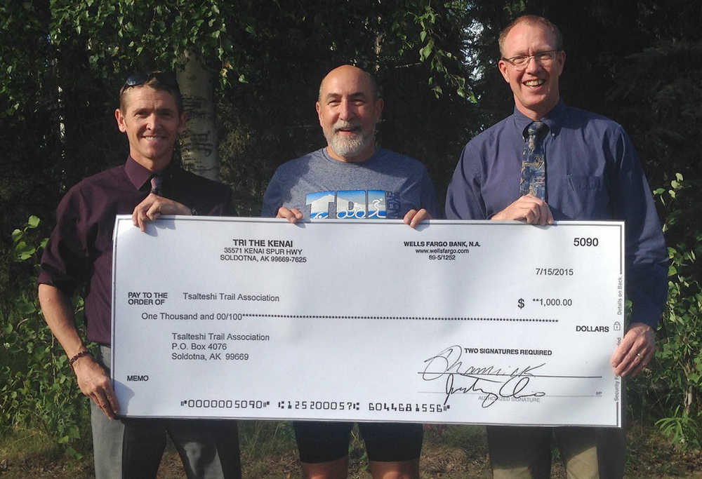 Tri The Kenai Triathlon recently donated $1,000 to the Tsalteshi Trail Association. The annual triathlon utilizes the trails for the run portion of the race. Pictured are Tsalteshi Trail Association Vice Chair Mike Crawford, Tri The Kenai Race Director Tony Oliver and Tsalteshi Trail Association Chair John Pothast. (Submitted photo)