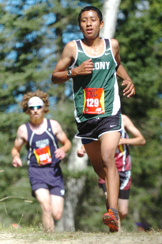 Ben Boettger/Peninsula Clarion Colony High School varsity runner Luke Mellor approaches a downhill stretch of the race course during the Tsalteshi Invitational Cross Country race at Skyview High School on Saturday, August 22.