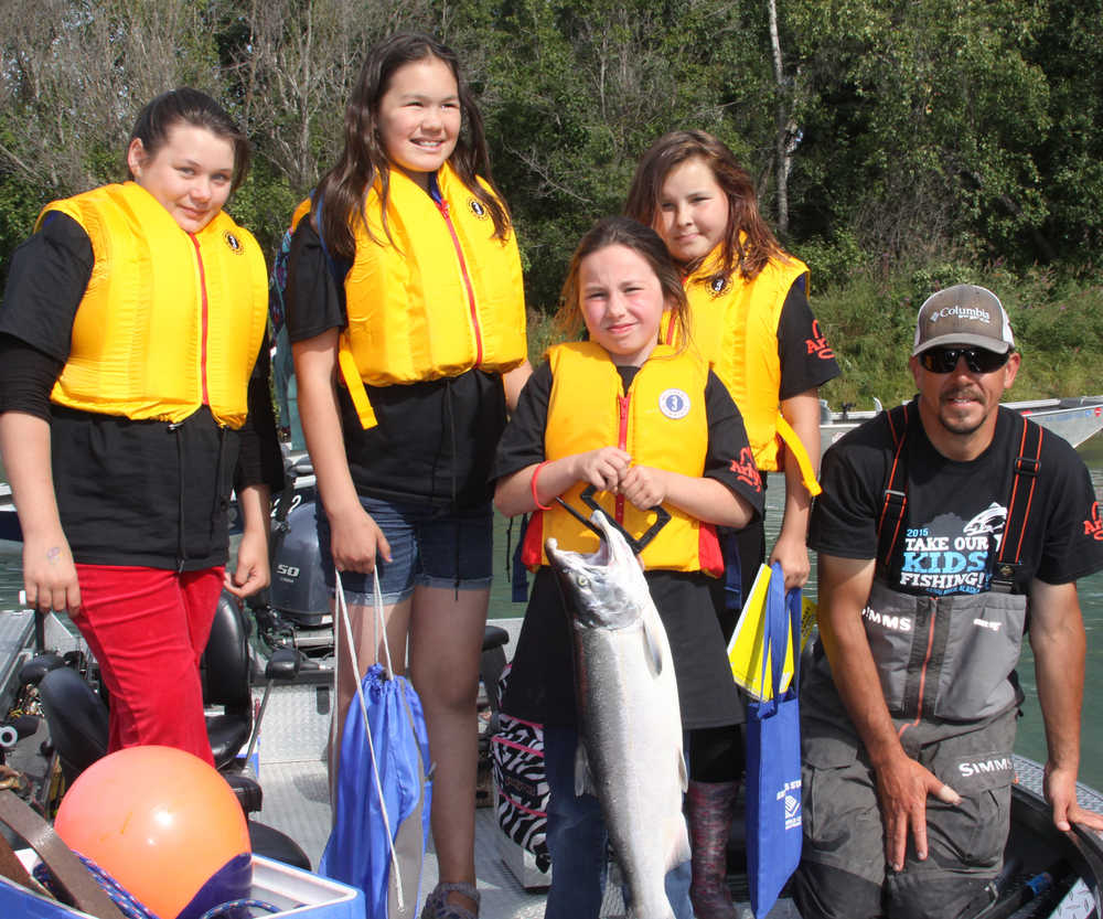 Guide  takes kids fishing