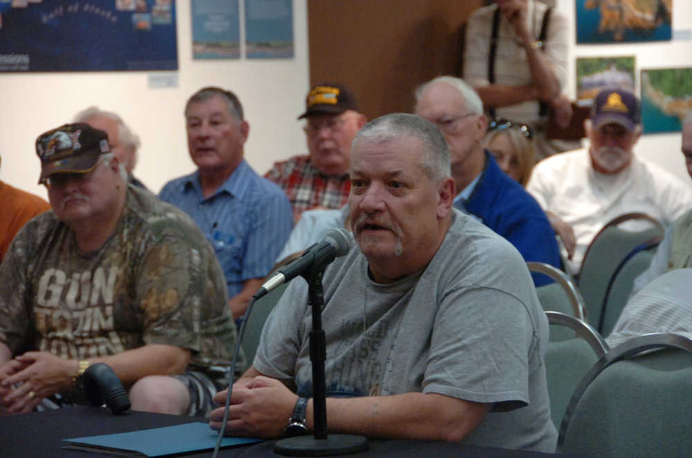 Photo by Megan Pacer/Peninsula Clarion Kenai resident Daniel Newman, a veteran suffering from stage three throat cancer, addresses Sen. Dan Sullivan and Veterans Affairs Under Secretary for Health Dr. David Shulkin during a VA listening session held Monday, Aug. 24 2015, at the Kenai Chamber of Commerce and Visitor Center in Kenai, Alaska.