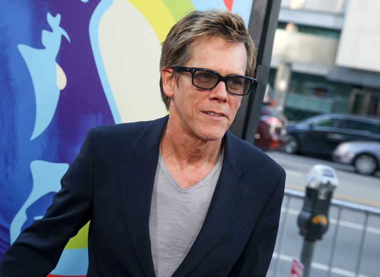 In this June 2 file photo, Kevin Bacon arrives at the LA Premiere Of "Love & Mercy" in Beverly Hills, Calif. Bacon stars in the independent release "Cop Car." (Photo by Rich Fury/Invision/AP, File)