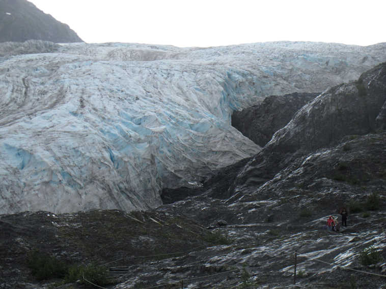 This photo taken Aug. 4, 2012, shows tourists walking to Exit Glacier in Kenai Fjords National Park just outside Seward, Alaska. President Barack Obama will visit Alaska next week to press for urgent global action to combat climate change, even as he carefully calibrates his message in a state heavily dependent on oil. (AP Photo/Mark Thiessen)