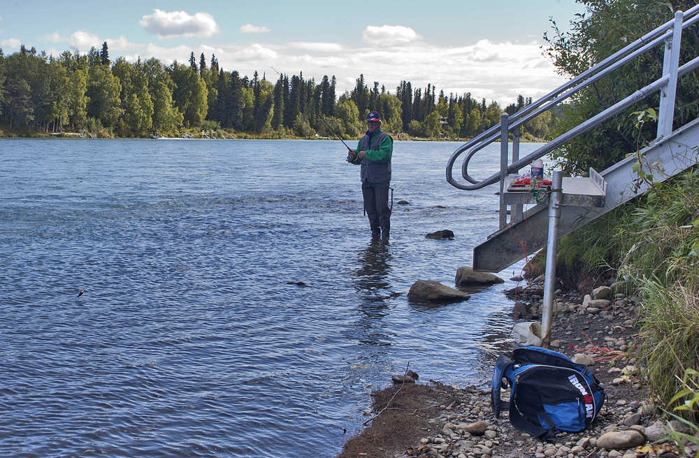 Photo by Rashah McChesney/Peninsula Clarion  Eduard Kernan, of Switzerland, makes use of the Centennial Park Trail to fish and clean his catch on Sunday August 30, 2015 in Soldotna, Alaska.