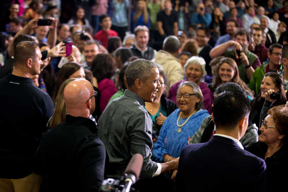 President Barack Obama greets members of the audience after delivering remarks at Kotzebue School, Wednesday, Sept. 2, 2015, in Kotzebue, Alaska. Obama is on a historic three-day trip to Alaska aimed at showing solidarity with a state often overlooked by Washington, while using its glorious but changing landscape as an urgent call to action on climate change. (AP Photo/Andrew Harnik)