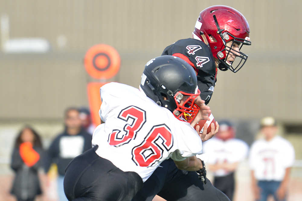 Photo by Rashah McChesney/Peninsula Clarion Kenai Kardinals' Andrew Wellborn runs for his second touchdown during the first 32 seconds of gameplay on Friday Sept. 4, 2015 during the team's game against Houston in Kenai, Alaska.