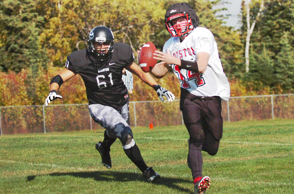 Ben Boettger/Peninsula Clarion Nikiski football player Kyle Rosado chases  during a game on Saturday, September 12 at Nikiski High School.