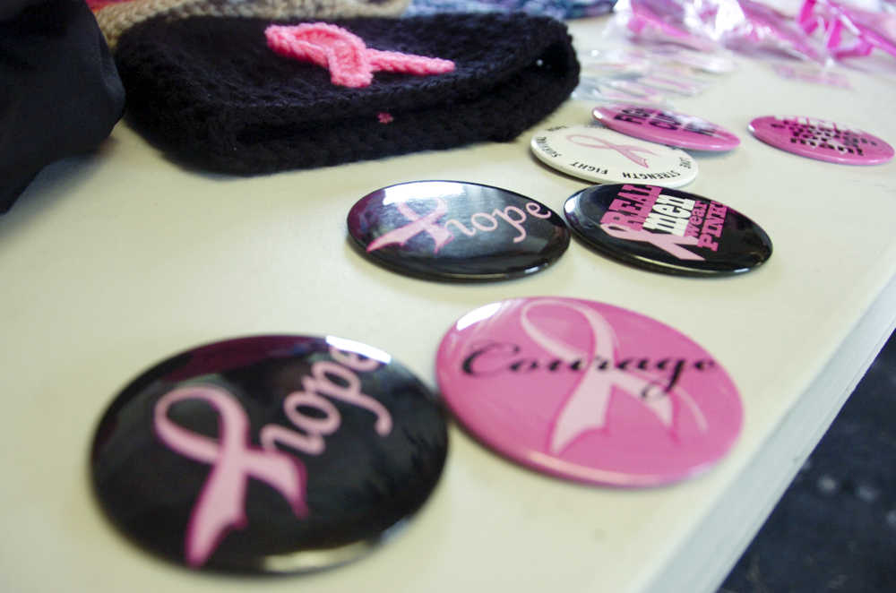 Photo by Megan Pacer/Peninsula Clarion Buttons, hats, sunglasses, neckalces, shirts and more were on sale at the Kenai Peninsula's inaugural Making Strides Against Breast Cancer Walk/Run on Sunday, Sept. 13, 2015 at the Tsalteshi Trails in Soldotna, Alaska. Proceeds from the event went to the American Cancer Society and to local patient programs.