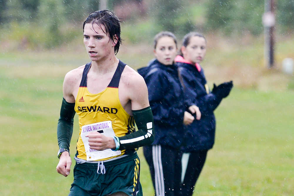 Photo by Rashah McChesney/Peninsula Clarion  Seward's Hunter Kratz finishes first with a time of 10:18.5 during the Kenai Peninsula Borough's cross country championships on Tuesday Sept. 15, 2015 in Soldotna, Alaska.