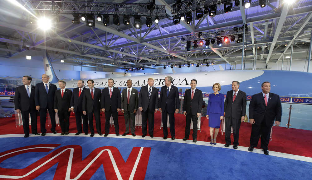 Republican presidential candidates, from left, former Pennsylvania Sen. Rick Santorum, former New York Gov. George Pataki,  Sen. Rand Paul, R-Ky., former Arkansas Gov. Mike Huckabee, Sen. Marco Rubio, R-Fla., Sen. Ted Cruz, R-Texas, retired neurosurgeon Ben Carson, businessman Donald Trump, former Florida Gov. Jeb Bush, Wisconsin Gov. Scott Walker, businesswoman Carly Fiorina, Ohio Gov. John Kasich, and New Jersey Gov. Chris Christie take the stage during the CNN Republican presidential debate at the Ronald Reagan Presidential Library and Museum on Wednesday, Sept. 16, 2015, in Simi Valley, Calif. (AP Photo/Chris Carlson)