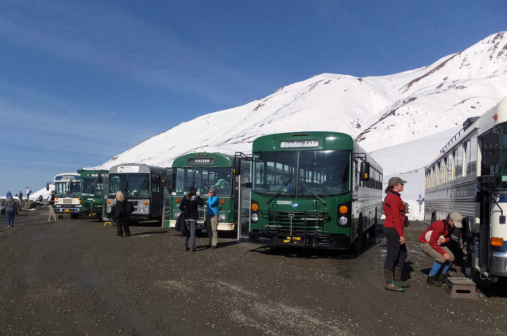 Buses are parked at Eielson Visitor Center, on Wednesday, Sept. 2, 2015, in Denali National Park and Preserve, Alaska. The summer travel season is winding down at Denali National Park and Preserve, a time of year that sees the vast majority of visitors to this largely wild place. (AP Photo/Becky Bohrer)
