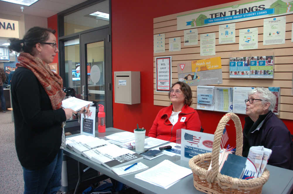 Photo by Megan Pacer/Peninsula Clarion From left to right: Brandi Kerley, Gail Knobf and Lois Pillifant discuss the barriers to getting young people to register to vote on Thursday, Sept. 17, 2015 at a table set up by the Central Peninsula League of Women Voters at the Kenai Peninsula College in Soldotna, Alaska.